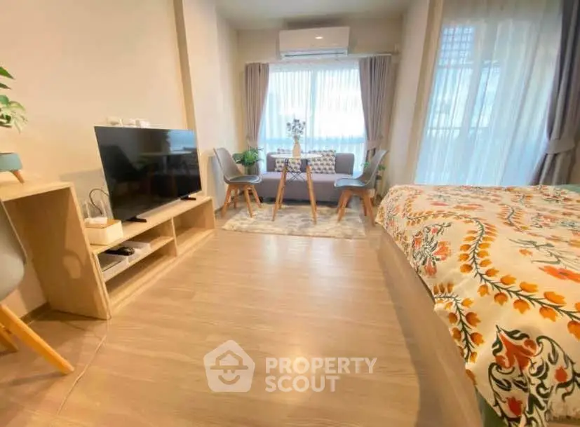 Cozy studio apartment with modern decor and natural light