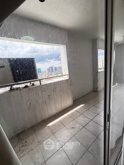 Spacious balcony with city skyline view, ideal for urban living enthusiasts.