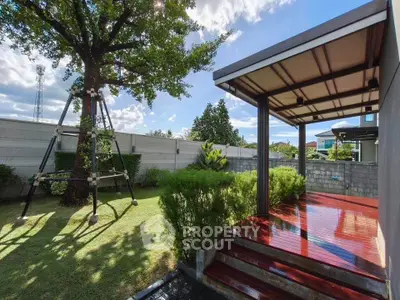 Charming backyard with lush garden and modern patio, perfect for outdoor relaxation and entertainment.