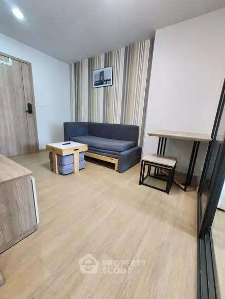 Modern living room with stylish furniture and wooden flooring