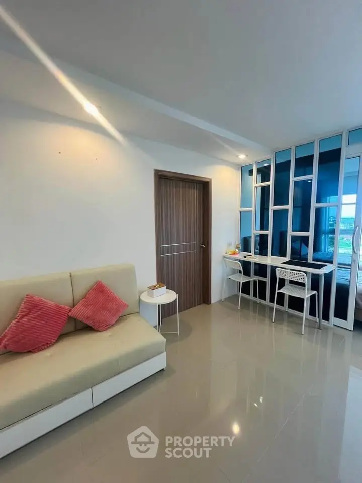 Modern living room with sleek design and cozy seating area