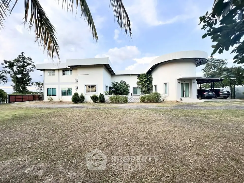 Modern two-story house with unique architecture and spacious front yard