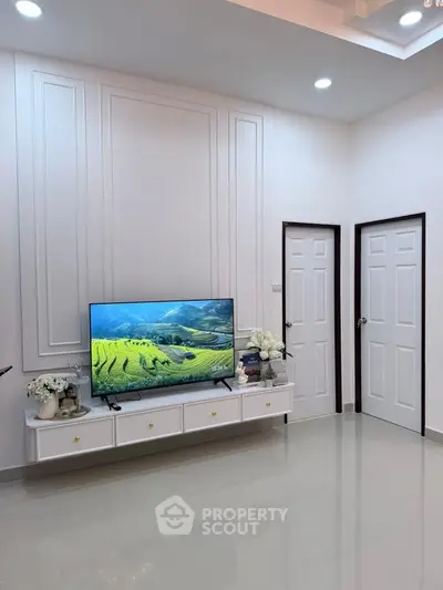 Modern living room with sleek TV unit and elegant decor