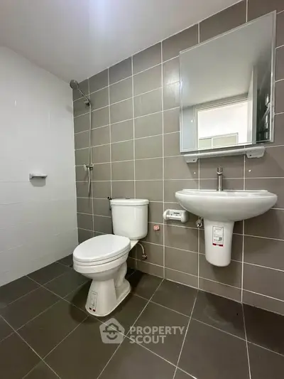 Modern bathroom with sleek fixtures and neutral tile design
