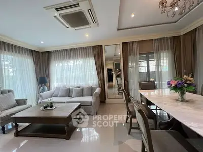 Elegant living room with modern furniture and large windows for natural light