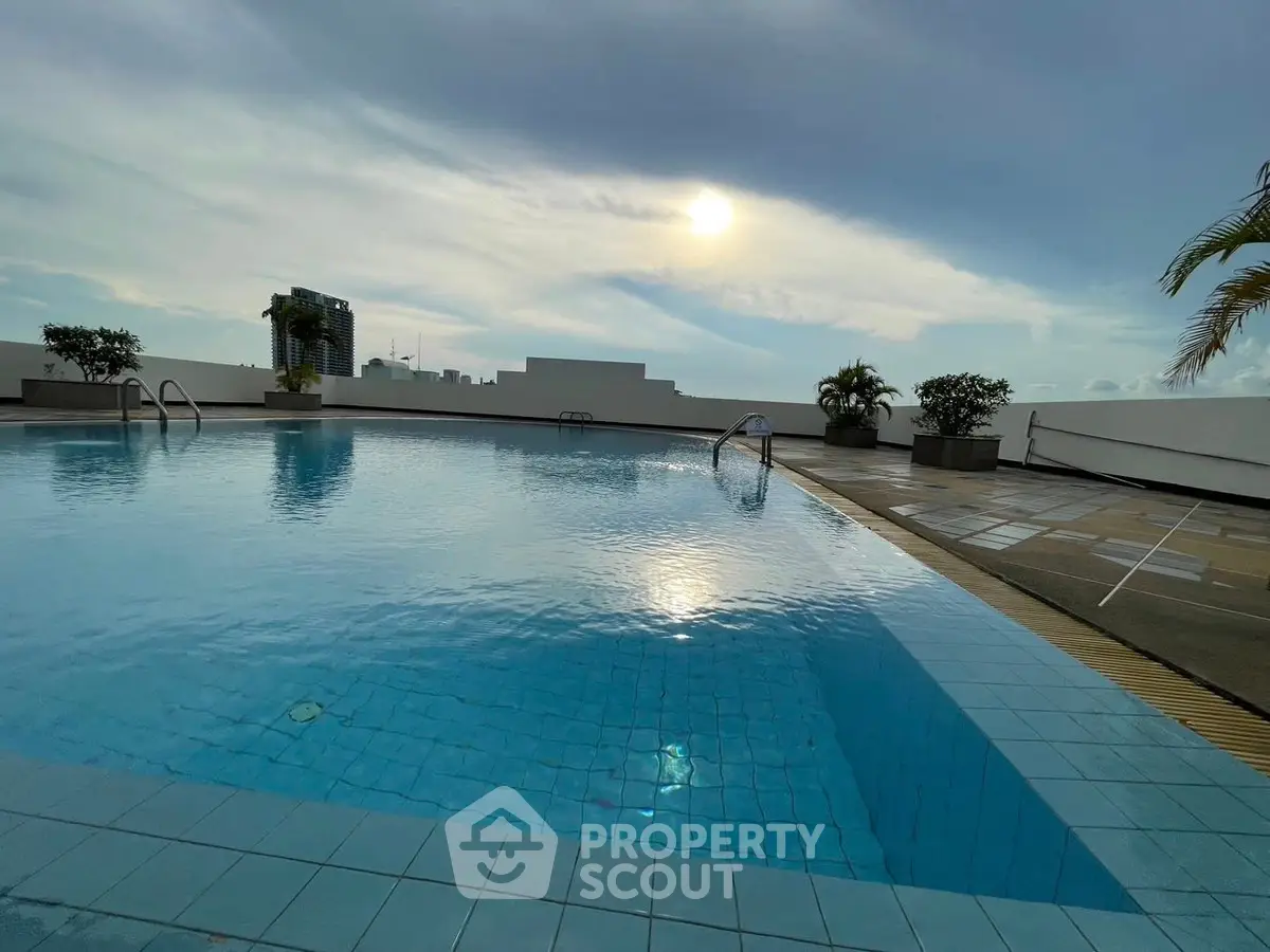 Stunning rooftop pool with panoramic city views and serene ambiance.