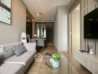 Modern living room with sleek furniture and elegant decor in a stylish apartment.