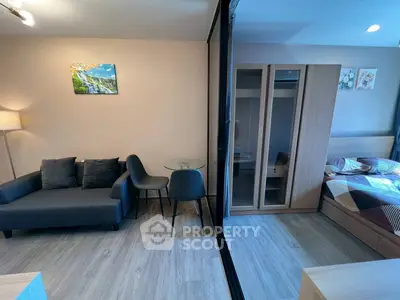 Modern studio apartment with cozy living area and stylish bedroom
