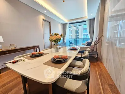 Luxurious modern living room with elegant dining area and large windows