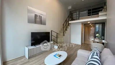 Modern loft-style living room with mezzanine and stylish decor