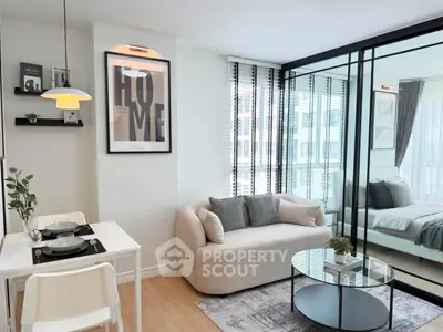 Modern living room with glass partition and cozy decor in a stylish apartment