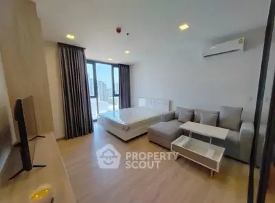 Modern studio apartment with stylish furnishings and city view