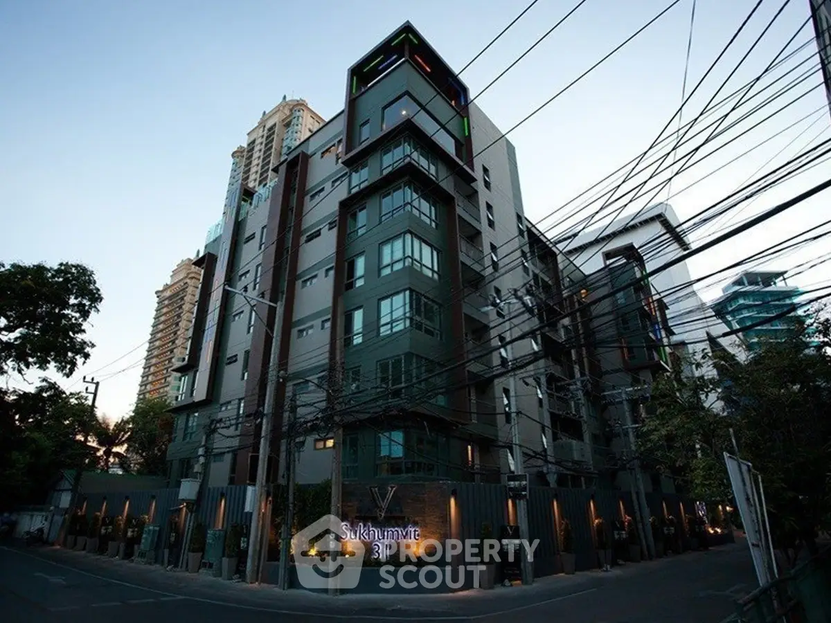 Modern urban apartment building with sleek design in prime city location.