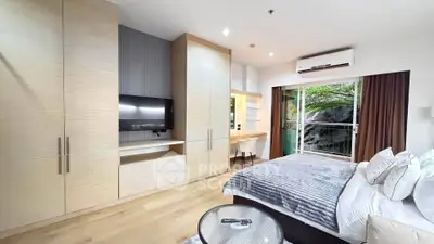 Spacious modern bedroom with built-in storage and natural light