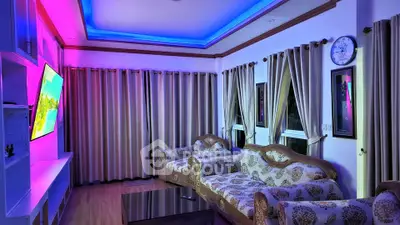 Modern living room with vibrant LED lighting and elegant furniture