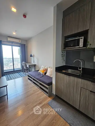 Modern studio apartment with open kitchen and cozy living area