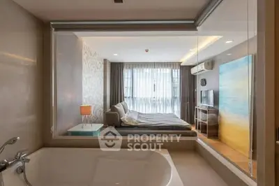 Modern apartment with open bathroom and cozy living area