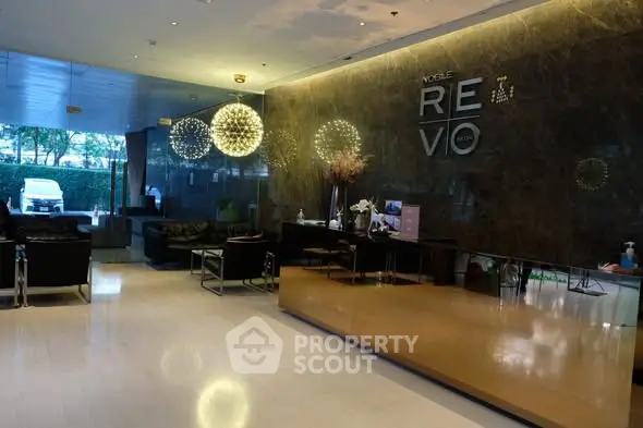Luxurious building entrance with modern decor and stylish lighting