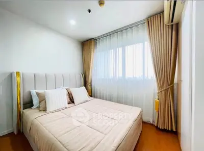 Cozy bedroom with elegant curtains and ample natural light
