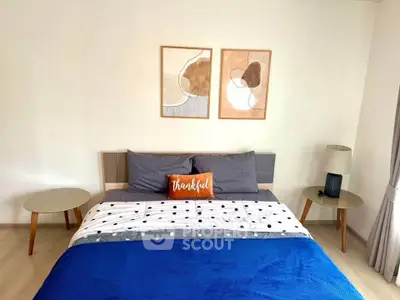 Modern bedroom with stylish decor and cozy bedding