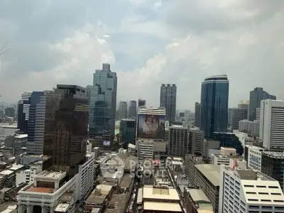 Stunning cityscape view showcasing modern skyscrapers and urban architecture under a cloudy sky.