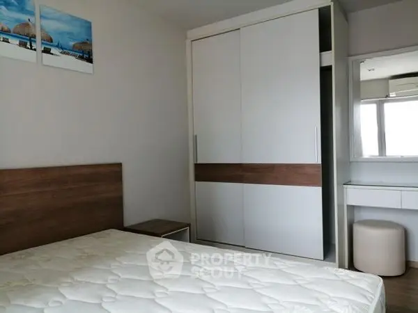 Modern bedroom with sleek wardrobe and minimalist decor
