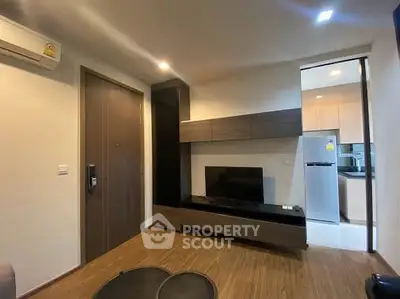 Modern living room with sleek wooden flooring and built-in entertainment unit