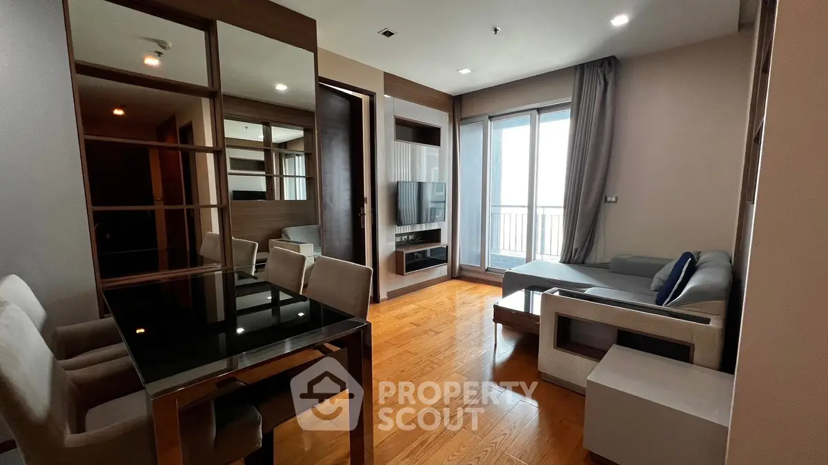 Modern living room with sleek furniture and large window for natural light