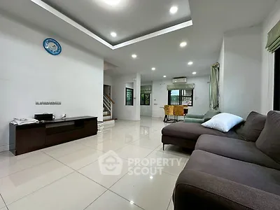 Spacious modern living room with sleek furniture and bright lighting