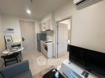 Modern apartment interior with cozy living area and compact kitchen