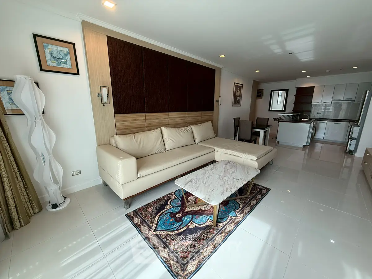 Spacious modern living room with elegant decor and open kitchen layout