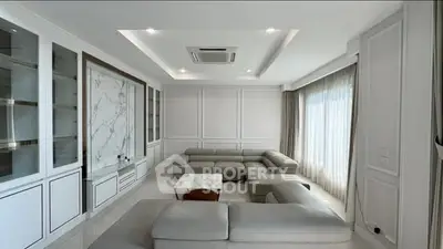 Luxurious modern living room with elegant sectional sofa and marble accents