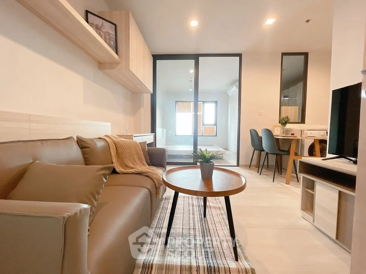 Modern living room with cozy sofa and stylish decor in a contemporary apartment.