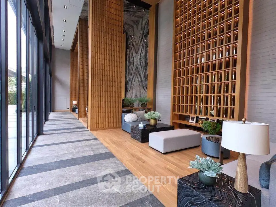 Luxurious modern lobby with elegant decor and floor-to-ceiling windows