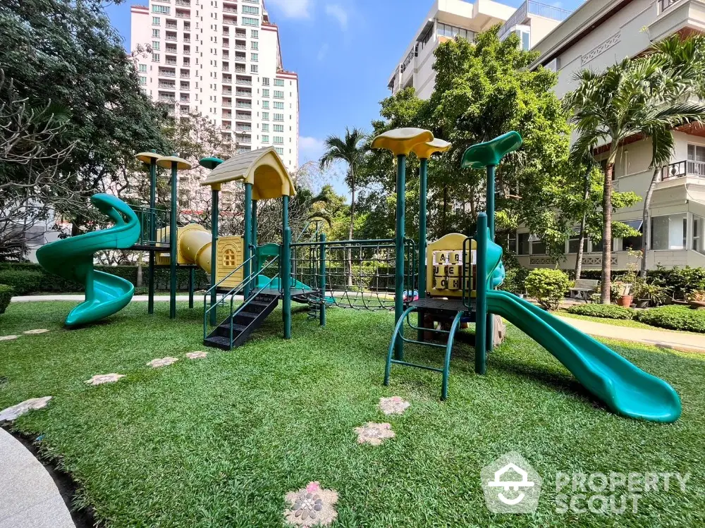 Charming residential playground with modern equipment and lush greenery in a vibrant urban setting.