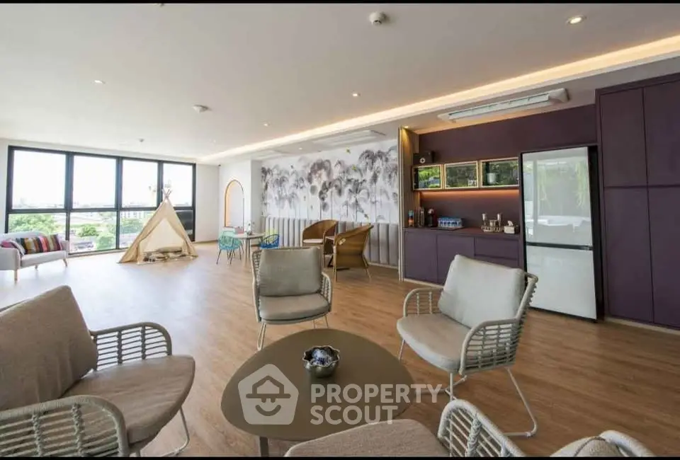 Spacious modern living room with large windows and stylish decor