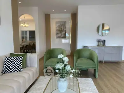 Elegant living room with modern decor and stylish furniture, featuring a cozy seating area and chic accents.