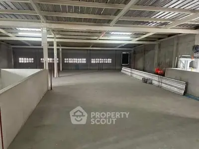 Spacious industrial warehouse with high ceilings and ample storage potential.