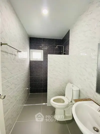 Modern bathroom with sleek tiles and contemporary fixtures