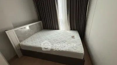 Cozy bedroom with natural light and elegant curtains