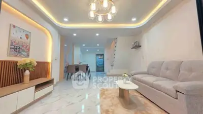 Spacious modern living room with elegant lighting and stylish decor