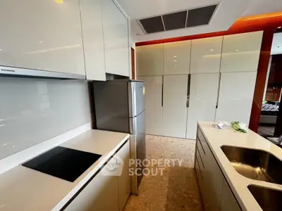 Modern kitchen with sleek cabinetry and stainless steel appliances