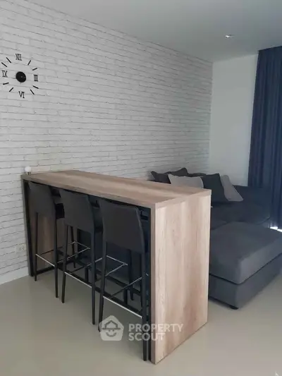 Modern living room with stylish bar table and cozy sectional sofa