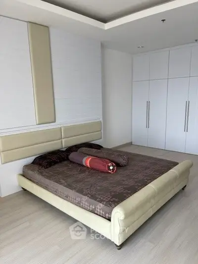 Modern bedroom with sleek design and spacious wardrobe
