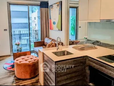 Modern living room with stylish decor and open kitchen in urban apartment