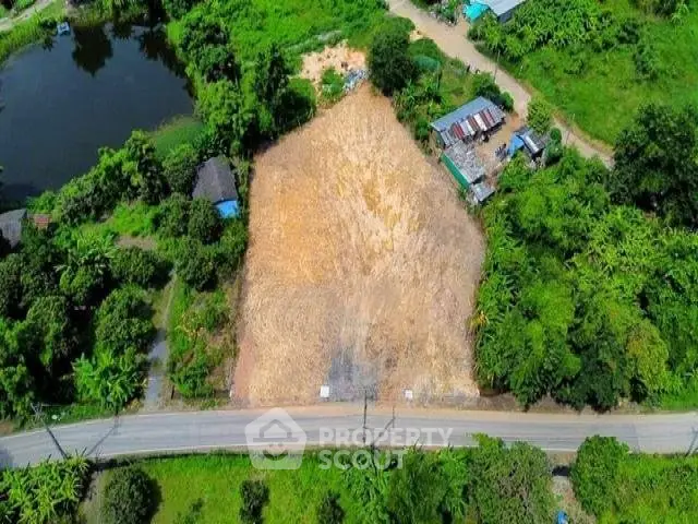 Prime land plot surrounded by lush greenery, ideal for development or investment.