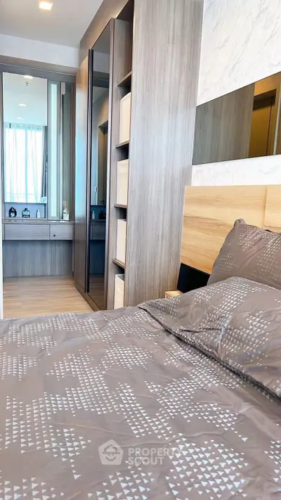 Modern bedroom with stylish decor and ample storage space