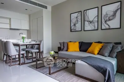 Modern living room with stylish decor and open kitchen layout, perfect for contemporary living.