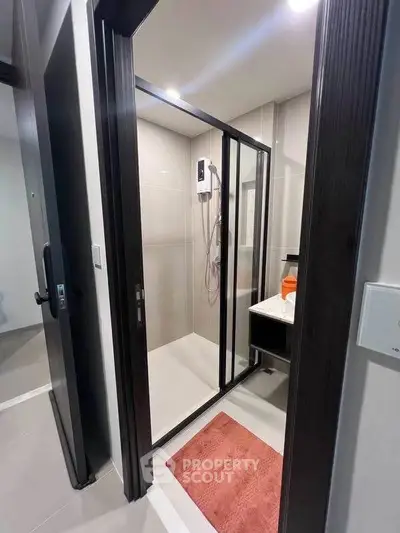 Modern bathroom with glass shower enclosure and sleek design