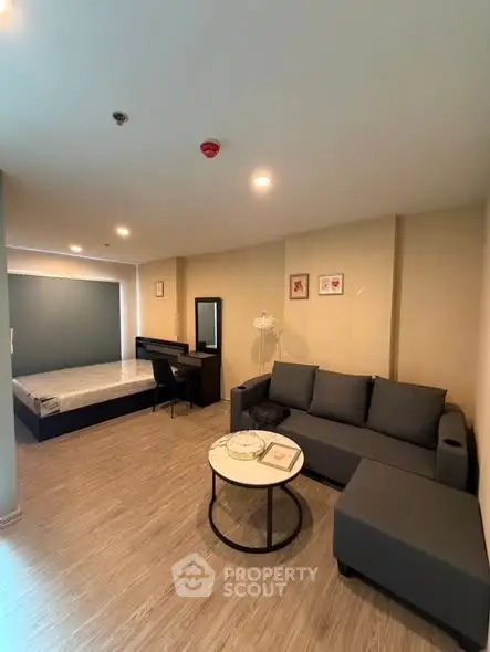 Modern studio apartment with cozy living area and stylish furnishings